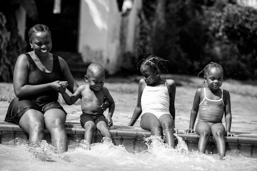 Black and White Photo of a Family in a Pool