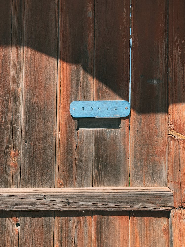 Mail Slot In Wooden Fence