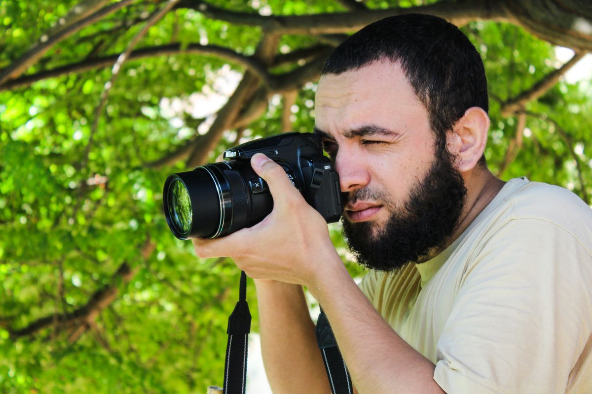 Photographer shooting with a DSLR