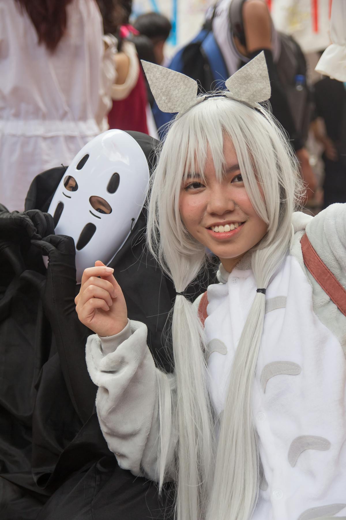 Family discussing health plans at kitchen table with notepad and laptop