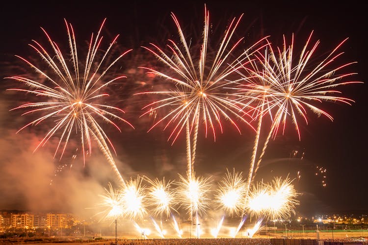 A Fireworks Display At Night Time