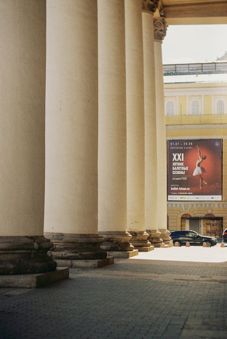 Poster Advertising Ballet At End Of Colonnade