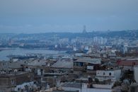 Aerial view of Algiers cityscape showcasing iconic architecture and Martyrs' Memorial.