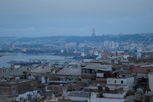 Aerial view of Algiers cityscape showcasing iconic architecture and Martyrs' Memorial.