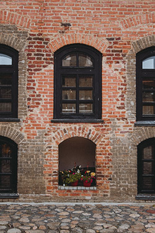 Photo of a Brick Wall with Windows 