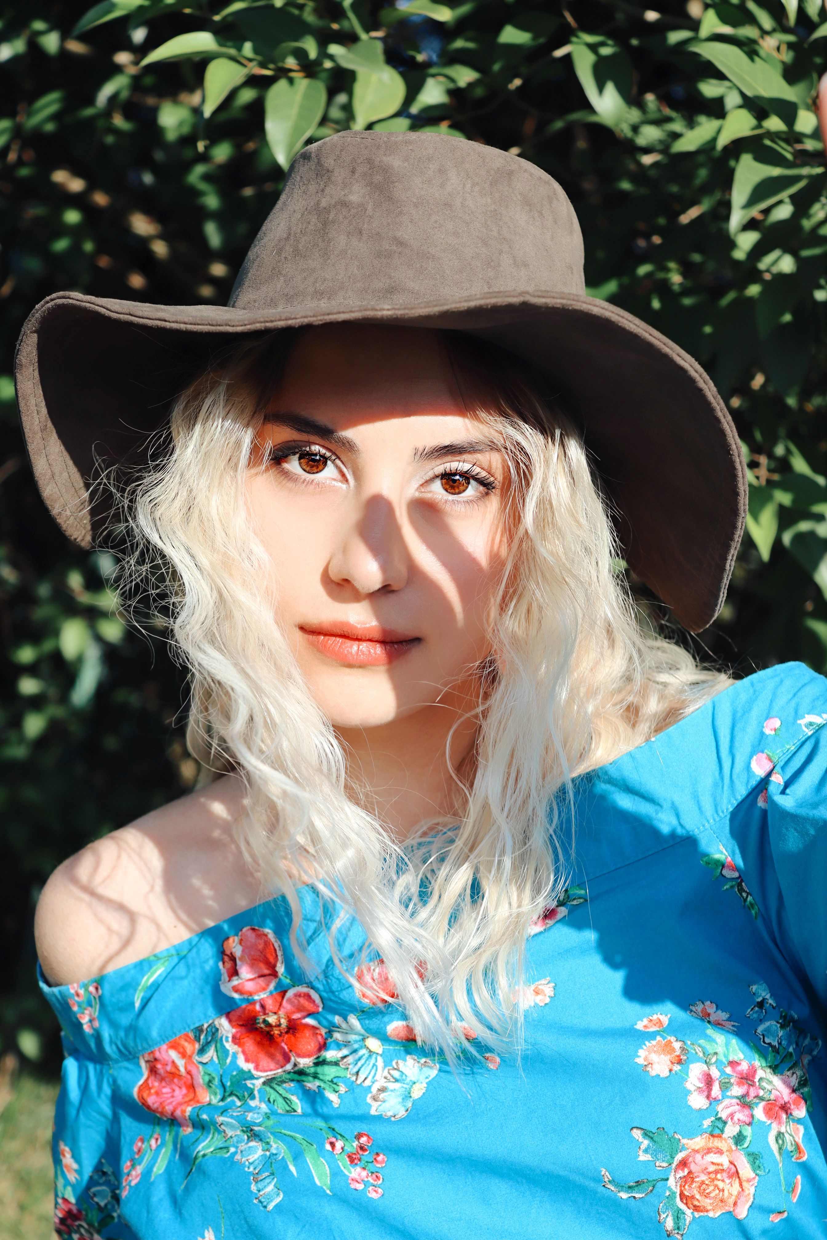 A Woman Wearing an Off Shoulder Floral Top · Free Stock Photo