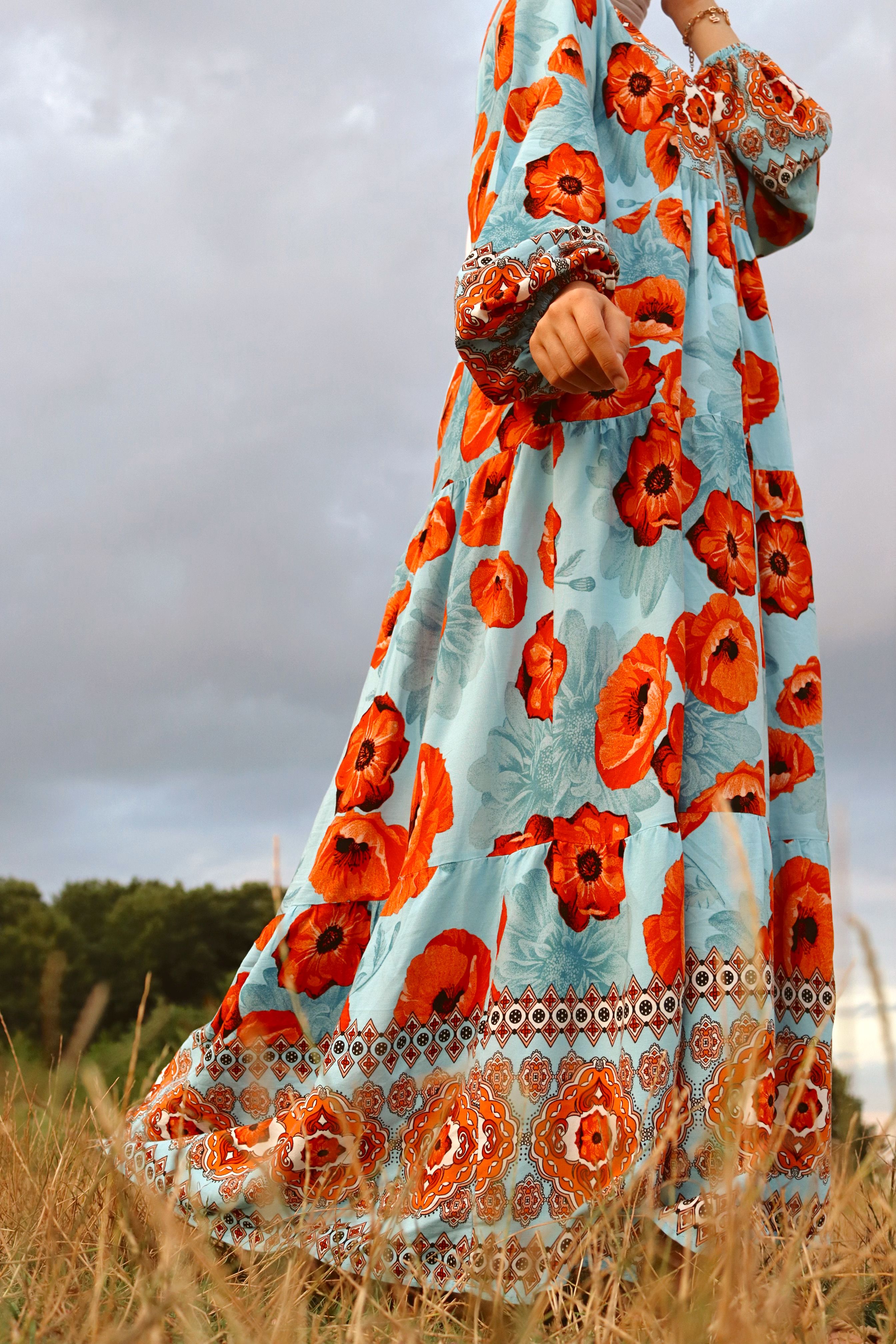 Woman in Green Dress Standing on Grass Field · Free Stock Photo
