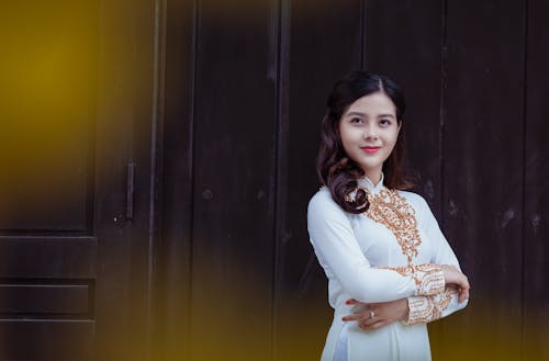 Gratis arkivbilde med ansiktsuttrykk, ao dai, asiatisk jente Arkivbilde