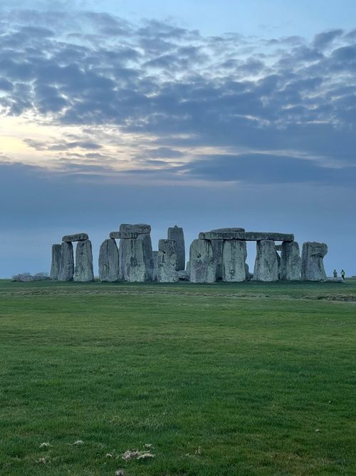 Free Experience the awe of Stonehenge, a prehistoric wonder, under a dramatic cloudy sky in England. Stock Photo