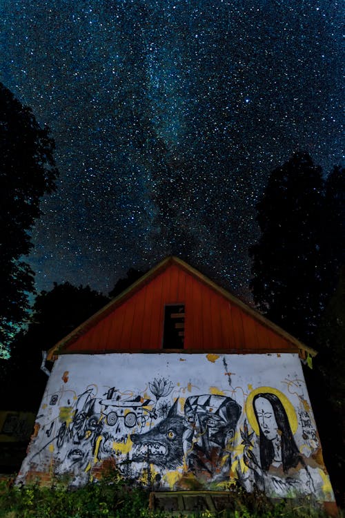 House With Shed Under A Night Sky