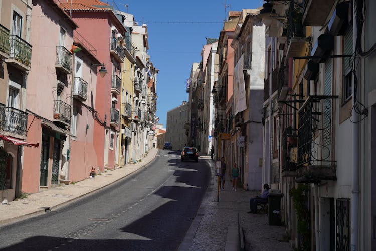 Cars Passing By The Street In A Town