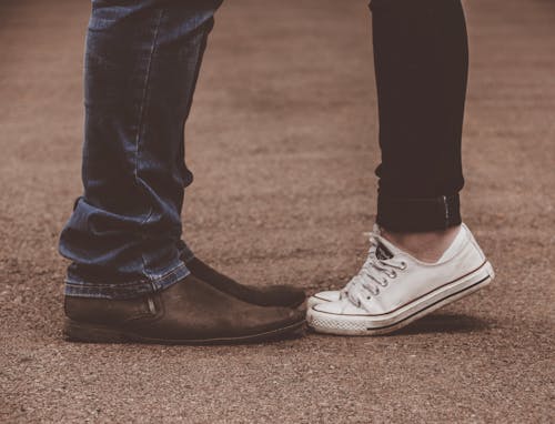 Free stock photo of boy, girl, pair of shoes Stock Photo