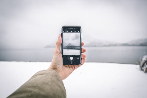 Close-Up Shot of a Person Holding a Cellphone