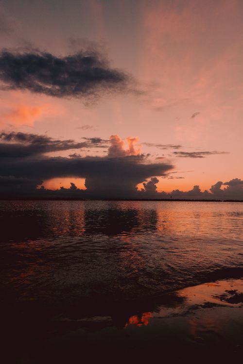 Free Tranquil evening scene at Igea Marina with stunning twilight hues reflecting on the water. Stock Photo
