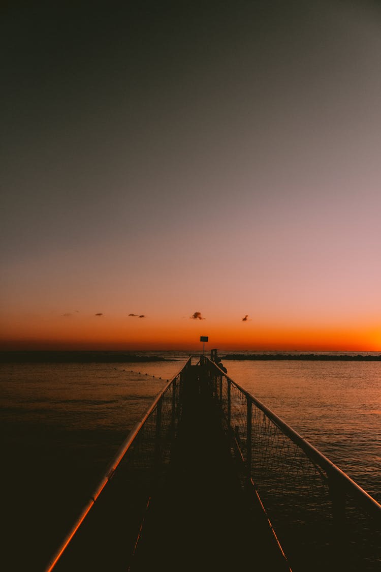 Jetty At Sea During Sunset