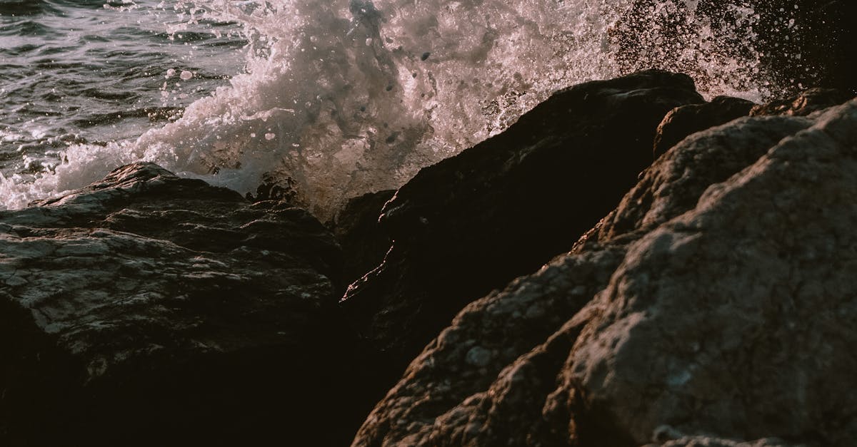 Water Splashing Against Rocks · Free Stock Photo