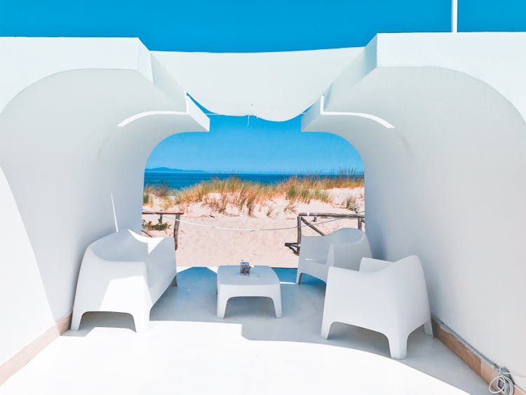 White Construction With Seats On A Beach