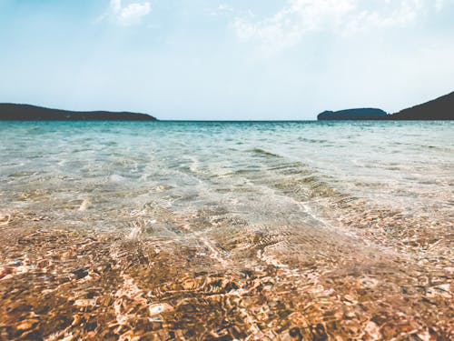 Foto profissional grátis de água, beira-mar, claro