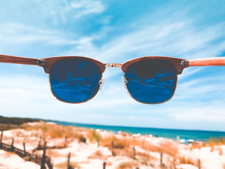 A Tinted Sunglasses With Wooden Frame