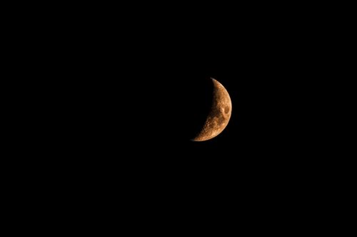 Free Detailed image of a crescent moon against a dark night sky in Lugano, Switzerland. Stock Photo