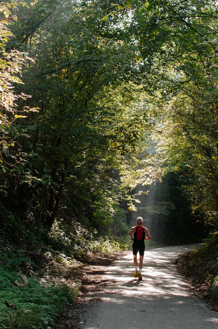 A Man Running On Trail