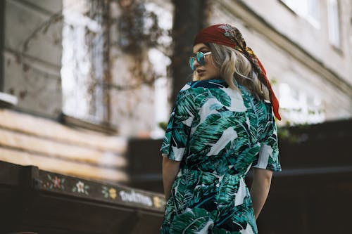 Tilt-shift Photography of Woman Wearing White, Teal, and Black Romper Pants