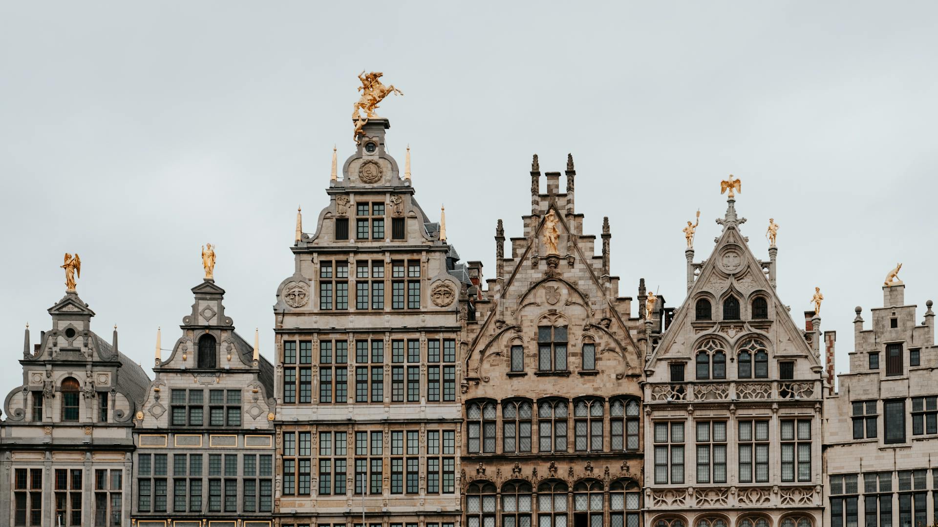 Ornate and historic gabled buildings in Antwerp, showcasing European architectural design.