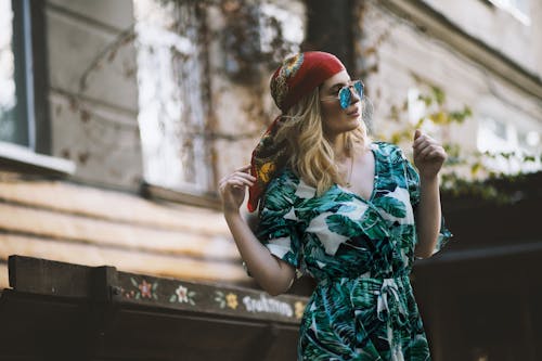 Free Woman in Green Dress Holding Her Hair Stock Photo