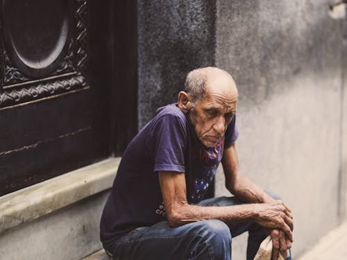 Photo of an Elderly Man Sitting