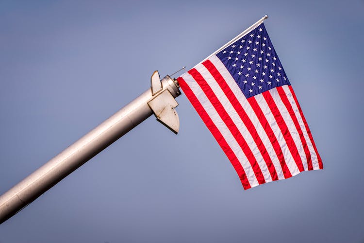 American Flag On Blue Sky