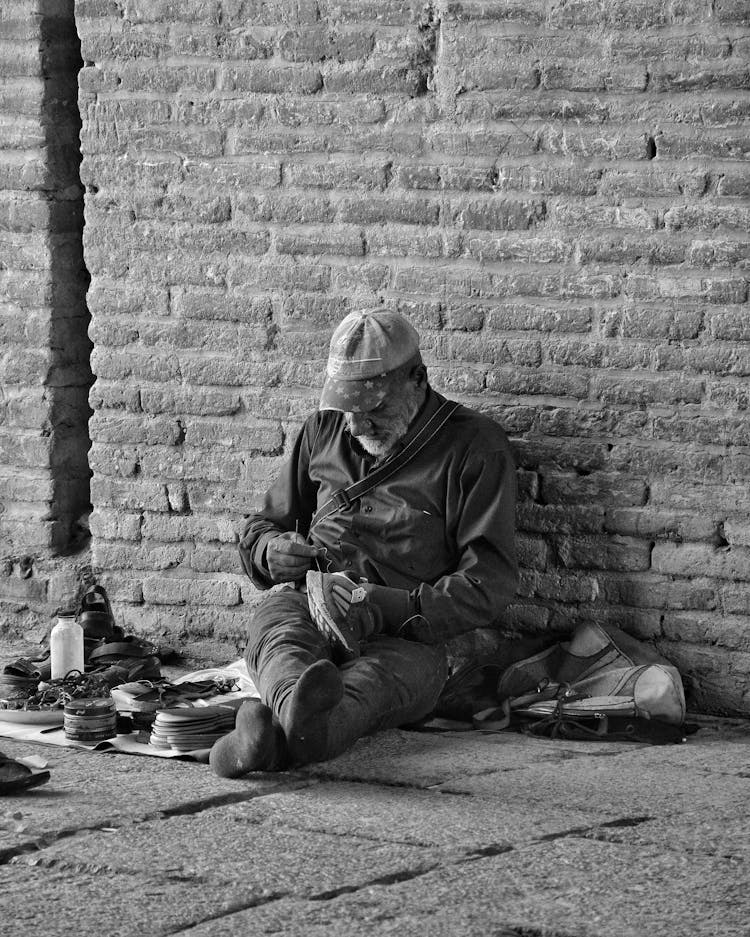 Male Shoemaker On The Sidewalk