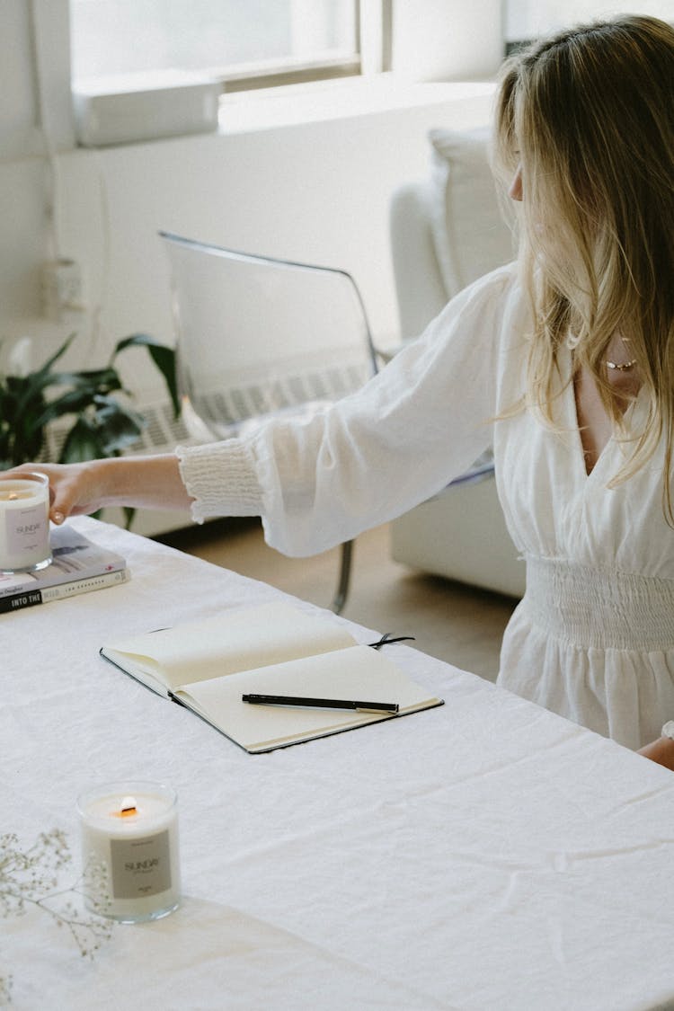 Woman Decorating Table With Candles