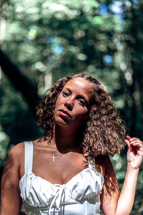 Beautiful Woman Holding her Curly Hair