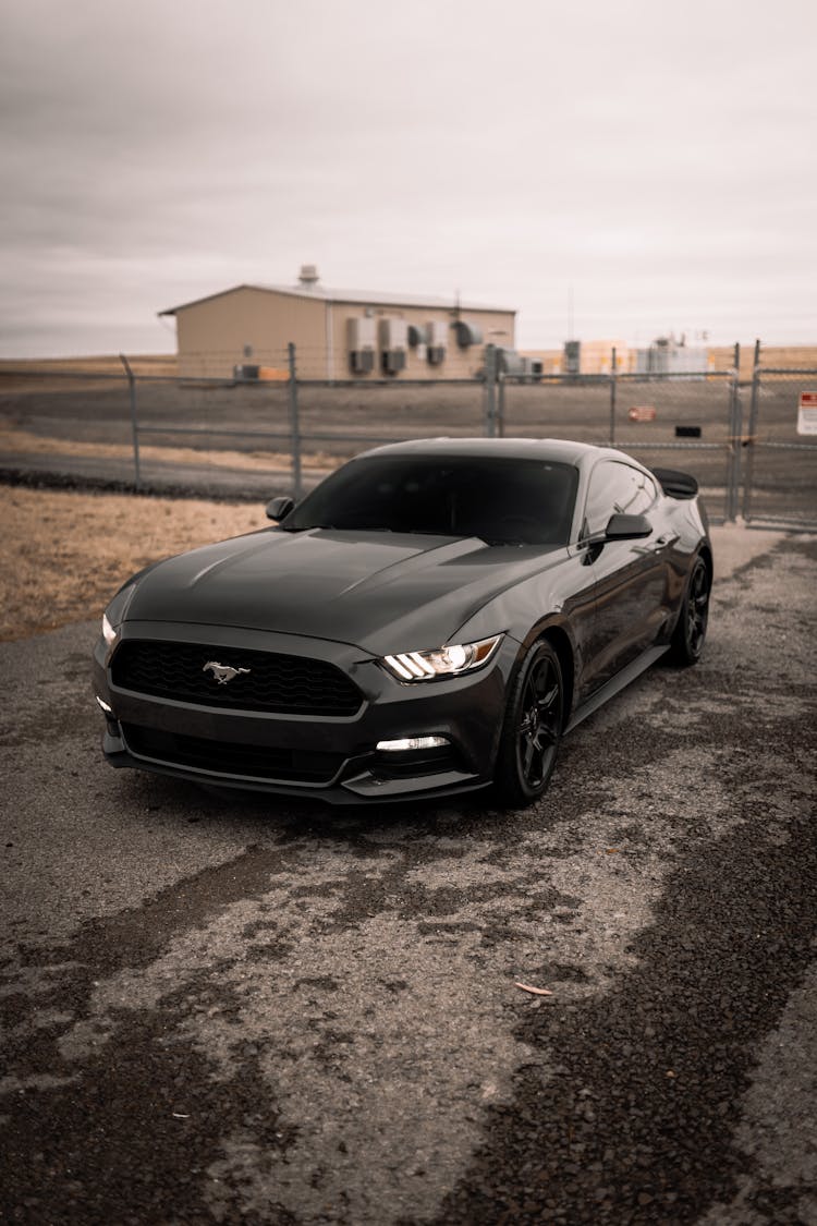 A Black Ford Mustang Parked On The Street