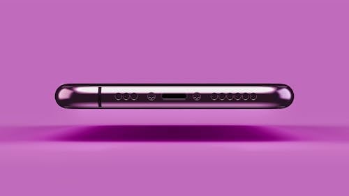Bottom of a Levitating iPhone 11 Pro on a Pink Background