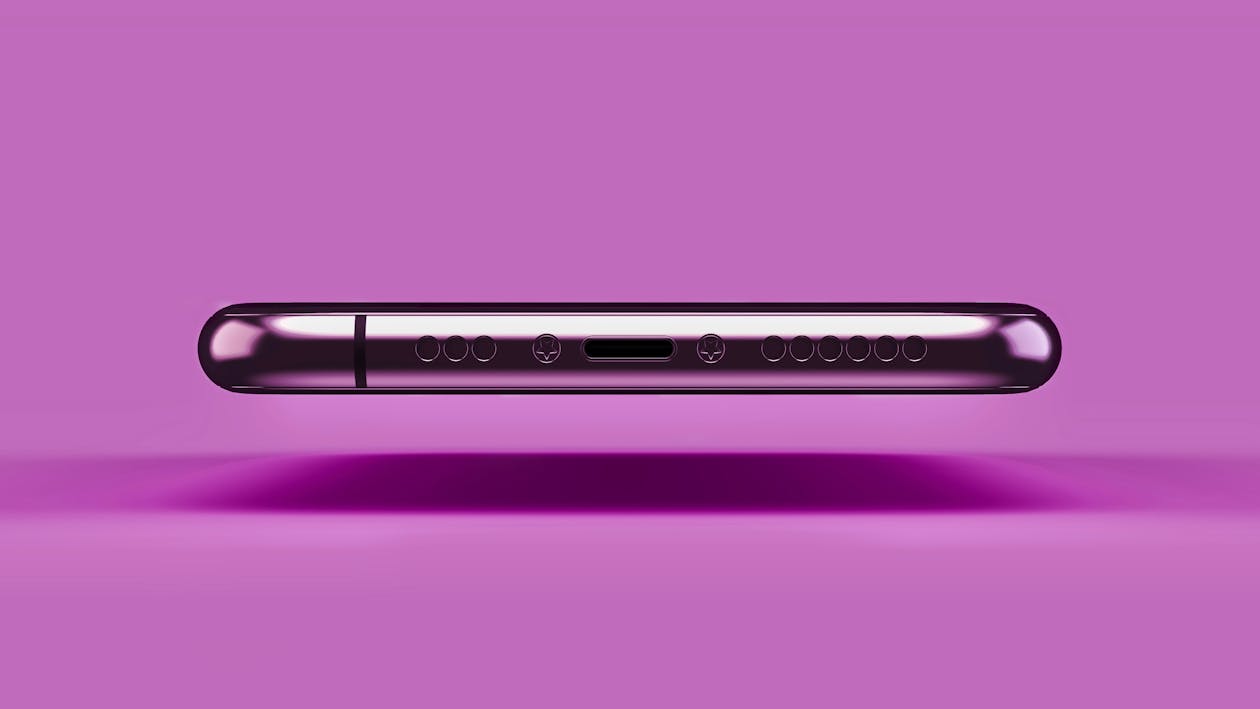 Bottom of a Levitating iPhone 11 Pro on a Pink Background