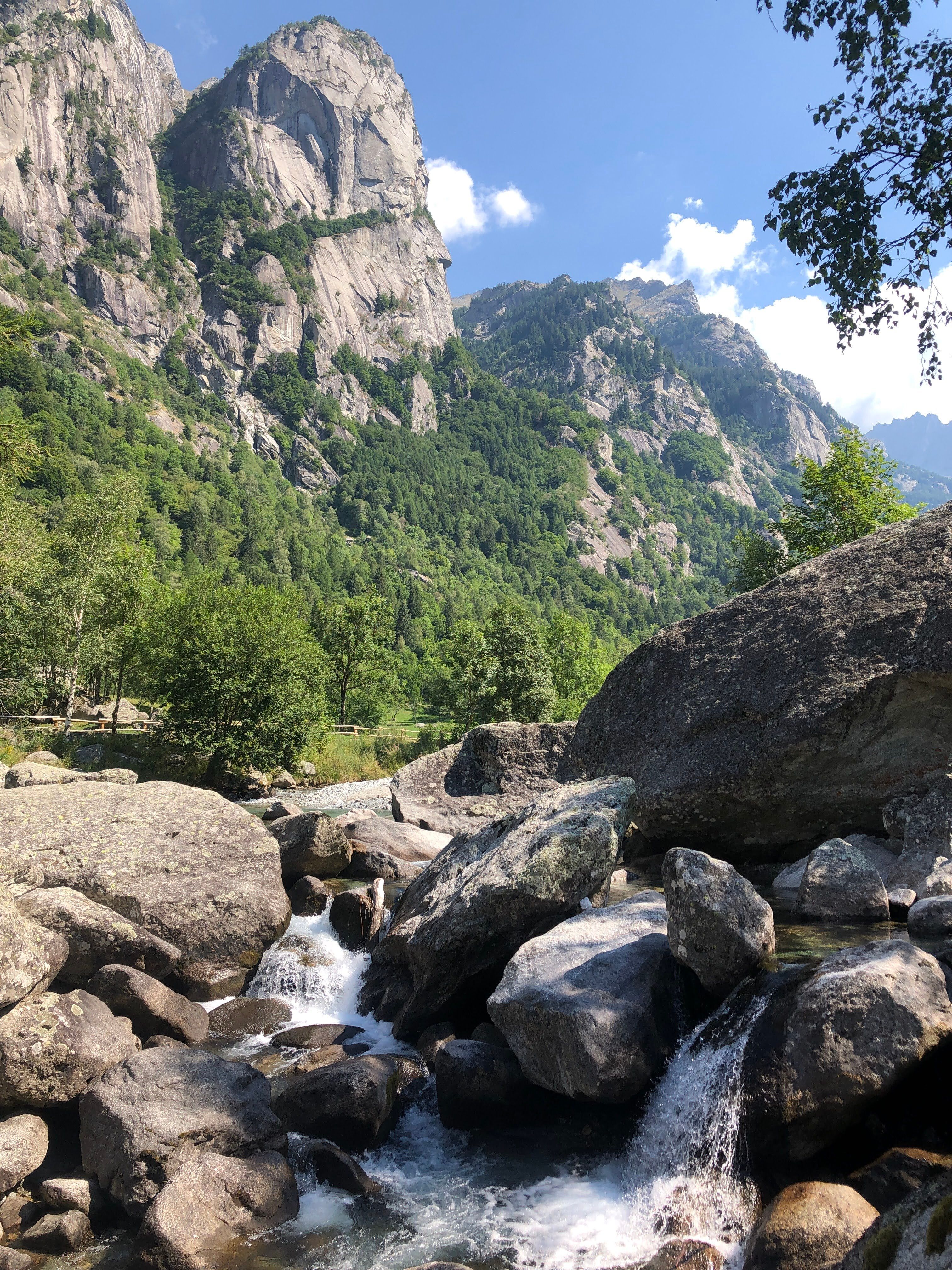 Breathtaking view of rocky mountains and river in Val Masino, Lombardy.