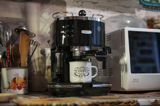 A Delonghi espresso machine brews coffee in a cozy kitchen setting. Perfect for caffeine lovers.