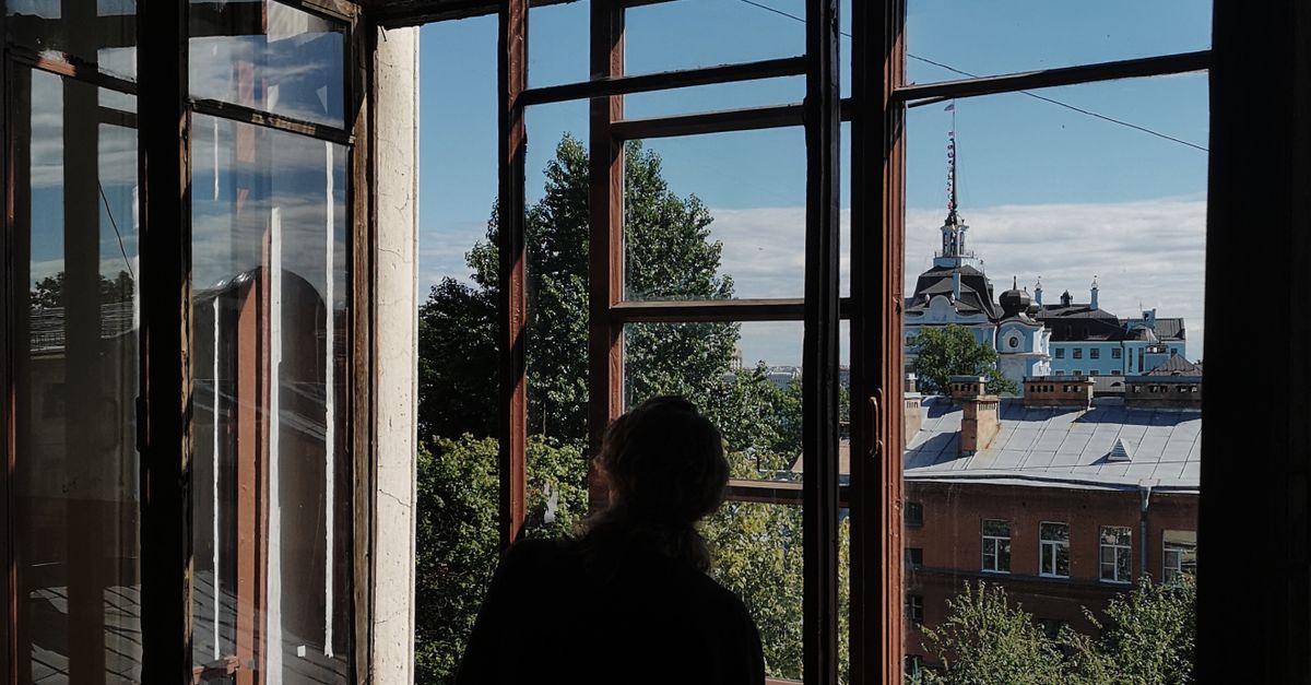 Silhouette of a Person Looking Outside the Window · Free Stock Photo