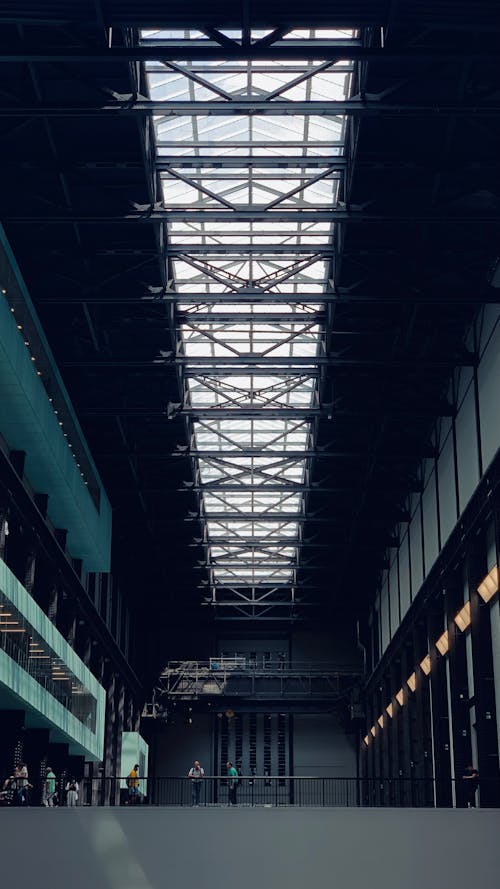 People in Hall with Windows on Ceiling