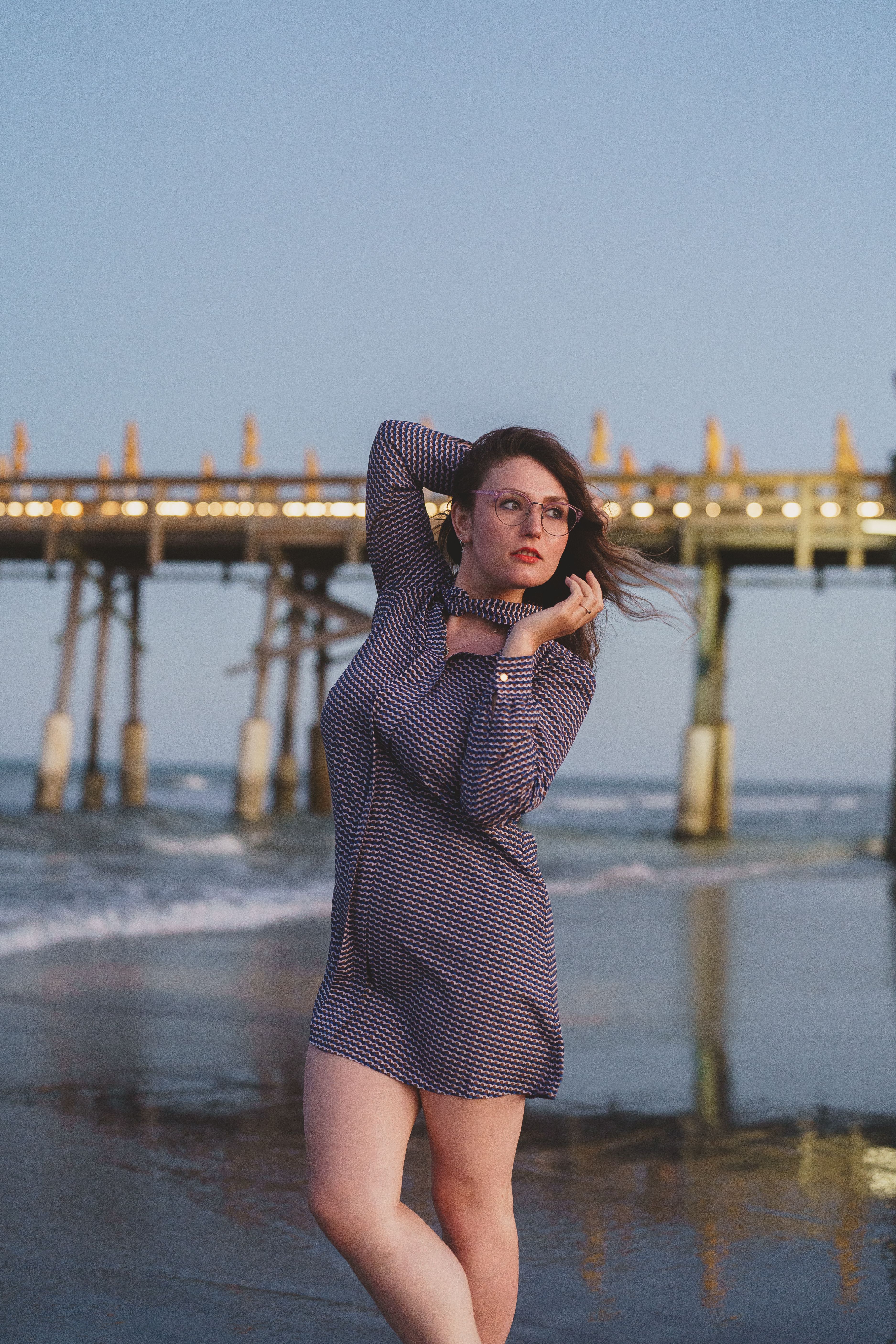 Beautiful Woman in a Dress Standing on a Beach · Free Stock Photo