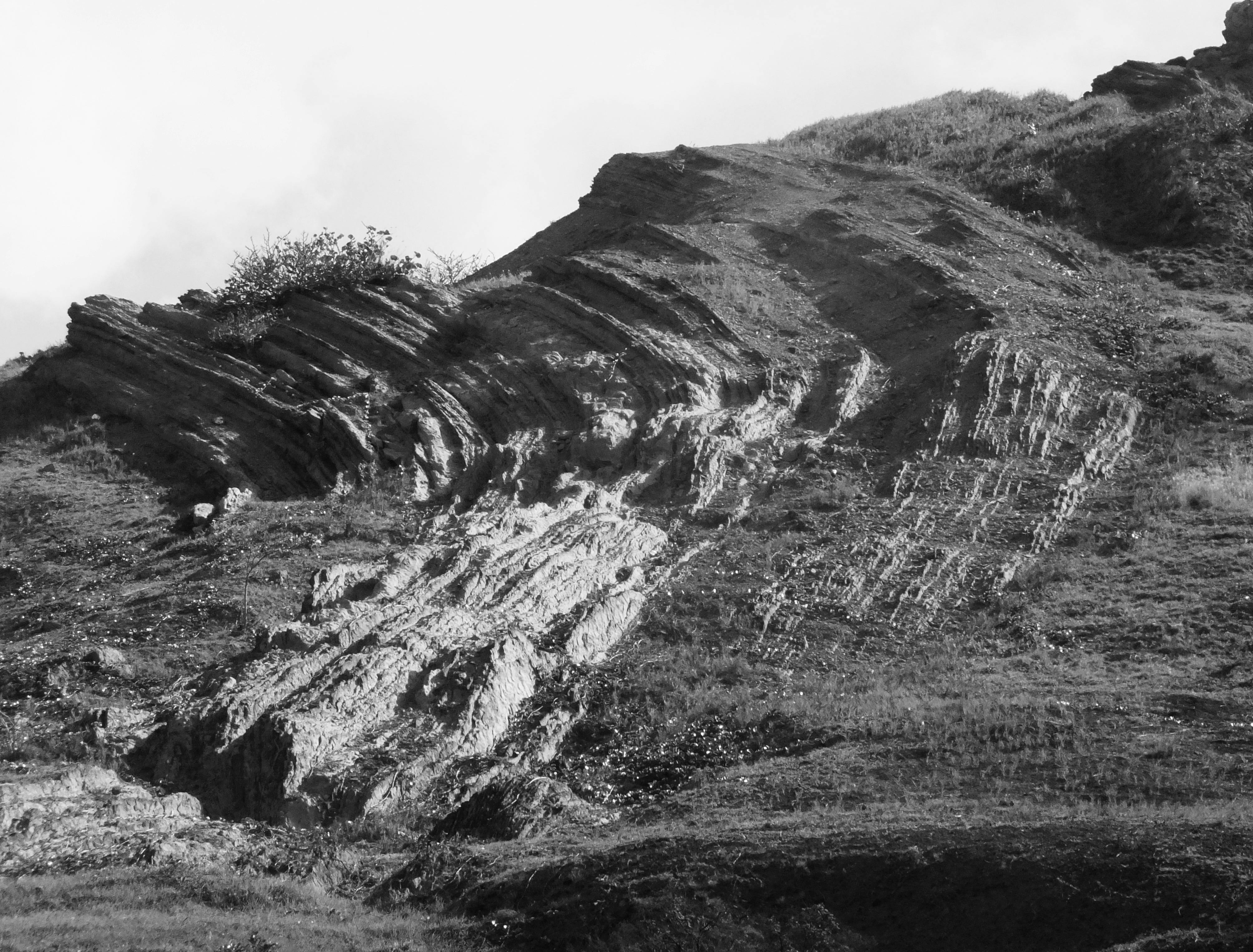 Close intimate embrace on bed with soft warm lighting, evoking deep trust and sensual surrender