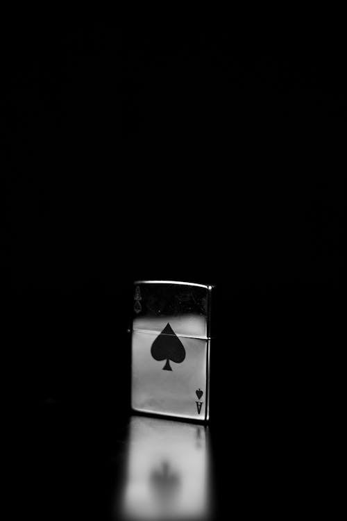 Grayscale Photo of a Lighter on Black Background