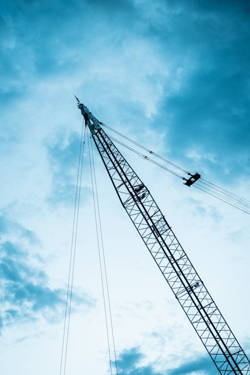 Low-Angle Shot of a Crane under the Cloudy Sky