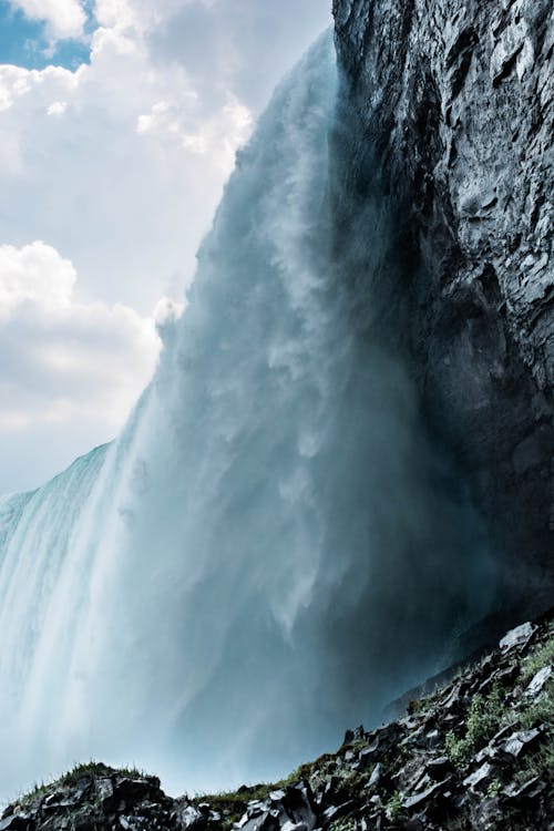 Low Angle Photography of Waterfall