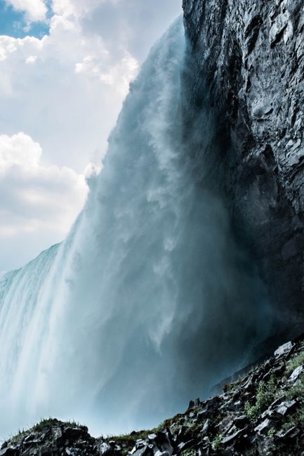 Dramatic angle of Niagara Falls waterfall showcasing powerful flow and natural beauty.
