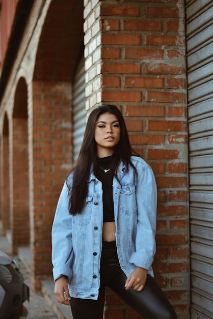 Portrait of Young Beautiful Woman in Leather Pants · Free Stock Photo