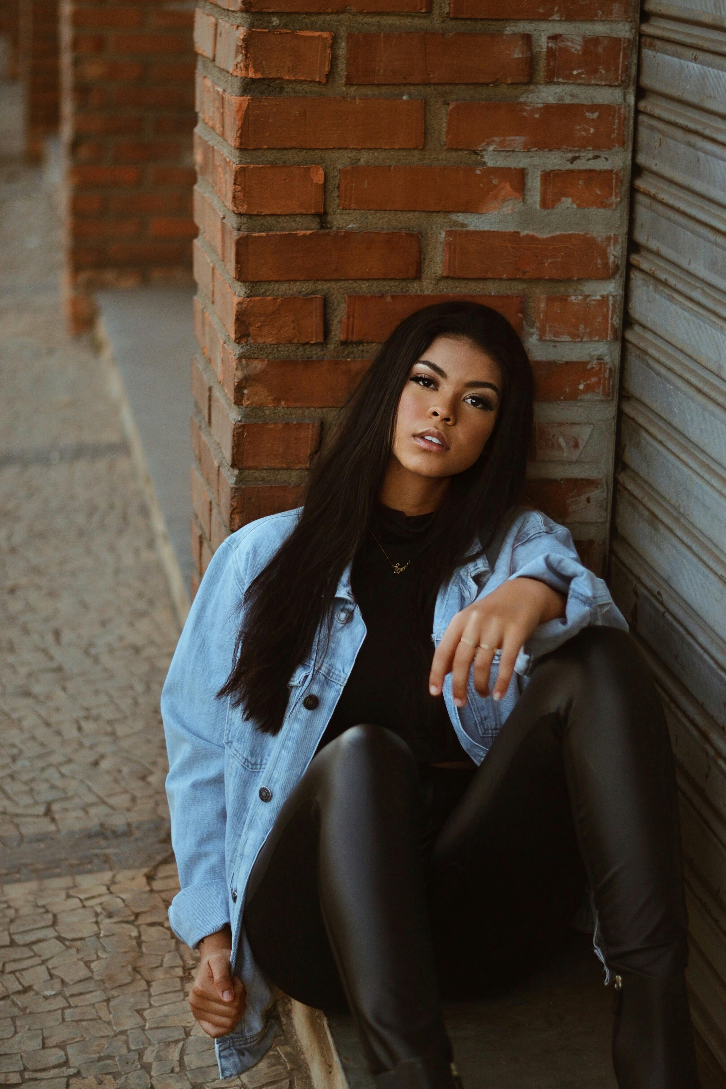 Portrait of Young Beautiful Woman in Leather Pants · Free Stock Photo