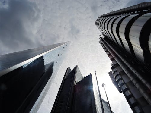 Low Angle Photo of High-rise Building over Cloudy Sky