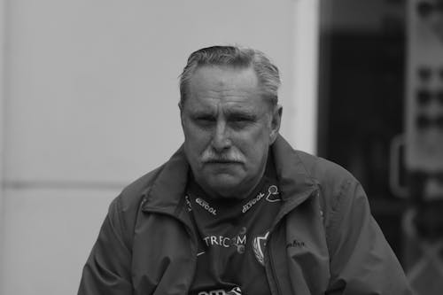 Grayscale Portrait of a Man with a Moustache